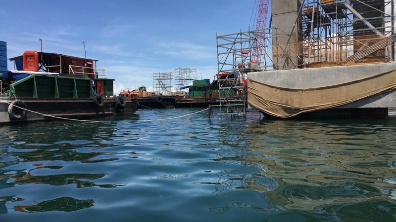 Water-level port infrastructure with boats and scaffolding